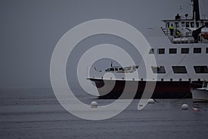 Ferry Heading Out On Foggy Morning