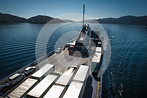 Ferry loaded with trucks and cars traveling from Wellington to Picton via Marlborough Sounds, New Zealand