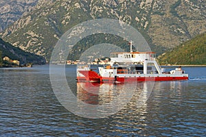 Ferry. Montenegro, Adriatic Sea, Bay of Kotor. Ferryboat runs across Verige Strait photo