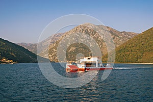 Ferry. Montenegro, Bay of Kotor. Ferryboat runs across narrowest part of the bay - Verige Strait