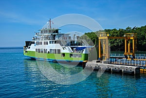 Ferry near the pier in the port Padang Bay, Bali