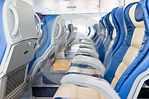 Ferry over sea. Interior of a ship with empty passengers seats and sea view.