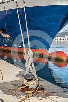 Ferry rope tied to metal boat slip at dock