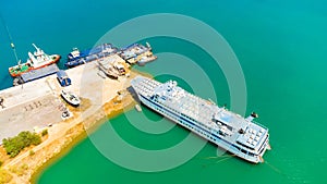 Ferry in the sea port. on the background cranes and containers