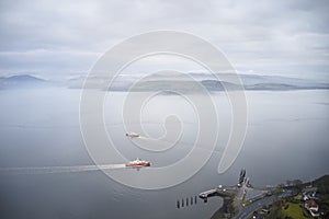 Ferry ship crossing on open vast ocean cruise journey aerial view from above during atmospheric weather sea island trip Scotland U