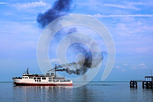 Ferry and smoke from the engine.