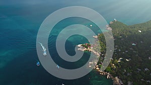 Ferry transportation in blue ocean aerial view. Sun island tropical top landscape. Summer vacation.