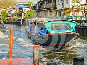 Ferryboat, public motorboat on small channel. Bangkok, Thailand