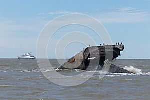 Ferrying people across the bay with stone ship seen in the picture