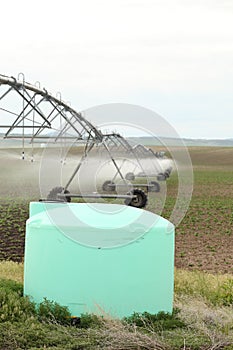 A fertigation tank for an agricultural sprinkler. photo