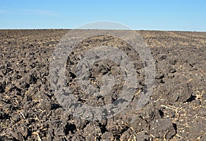 Fertile, plowed soil of an agricultural field