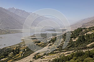 Fertile Wakhan Valley near Vrang in Tajikistan. The mountains in the background are the Hindu Kush in Afghanistan