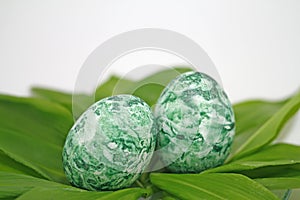 Fertility symbol, easter egg marbled with algae powder, fully organic