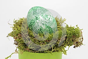Fertility symbol, easter egg marbled with algae powder, fully organic