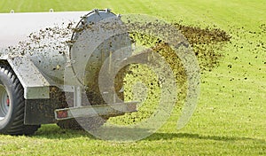 Fertilization with liquid manure on meadow