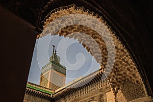 FES, MOROCCO. The minaret view and Inside interior of The Madrasa Bou Inania.