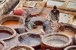 Three Men In The Chouara Leather Tannery