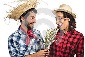 Festa Junina: party in Brazil. Brazilian couple wearing plaid sh photo