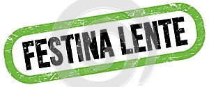 FESTINA LENTE, text written on green-black stamp sign photo