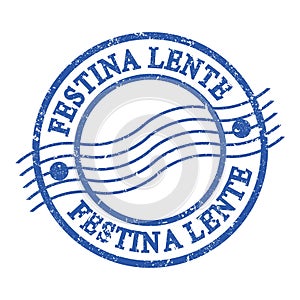 FESTINA LENTE, text written on blue postal stamp photo