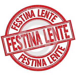 FESTINA LENTE written word on red stamp sign photo