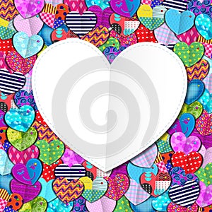 Festival of fabric hearts with various designs framing a greeting card