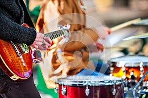 Festival music band. Friends playing on percussion instruments city park.