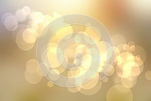 A festive abstract delicate gradient golden yellow background texture with glitter defocused sparkle bokeh circles. Card concept