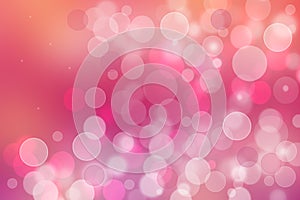 A festive abstract orange pink red gradient background texture with glitter defocused sparkle bokeh circles. Card concept for