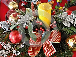 Festive Advent arrangement with yellow candle