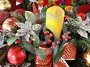 Festive Advent arrangement with yellow candle