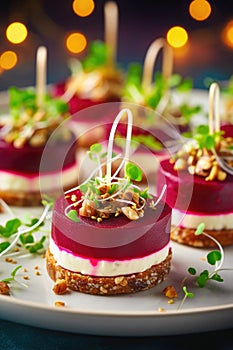 Festive appetizers from beetroot, cheese and multigrain bread on white plate