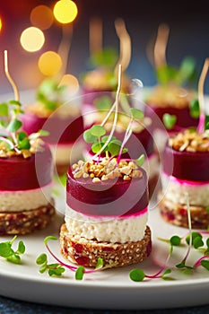 Festive appetizers from beetroot, cheese and multigrain bread on white plate