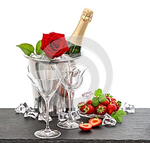 Festive arrangement with champagne, red rose and strawberries