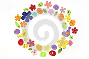 Festive background of colored flowers, birds, leaves, decorated with embroidery.