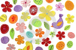 Festive background of colored flowers, birds, leaves, decorated with embroidery.