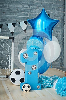 Festive background decoration for birthday with cake, letters saying one and blue balloons in studio, Boy Birthday .Cake Smash