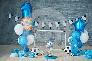 Festive background decoration for birthday with cake, letters saying one and blue balloons in studio, Boy Birthday .Cake Smash