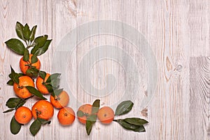 Festive background from mandarins with leaves