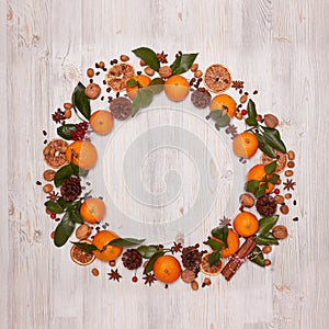 Festive background with mandarins, nuts, spices