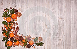 Festive background with mandarins, nuts and spices