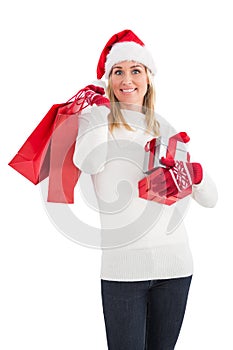 Festive blonde holding christmas gifts