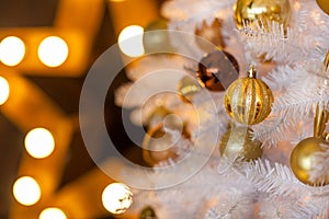 Festive blurred Christmas background with white Christmas tree