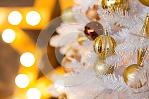 Festive blurred Christmas background with white Christmas tree