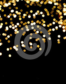 Festive bokeh background. Soft blur party lights. Golden holiday glowing backdrop