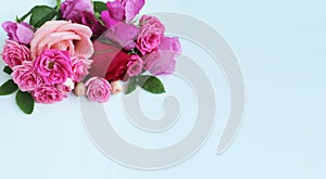 A festive bouquet with pink roses on a white background. Delicate floral arrangement.