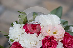 Festive bouquet of pink-white with wedding rings