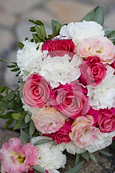 Festive bouquet of pink-white with wedding rings