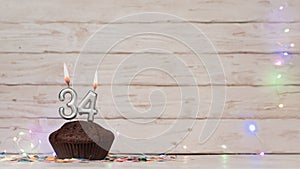 Festive card Happy Birthday with number of burning candles 34