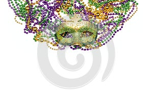 Festive Carnival mask and beads on a white background